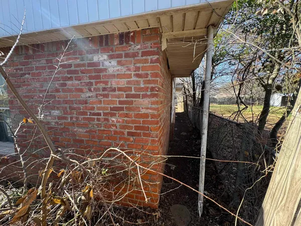 a bathroom with a shower and a glass door