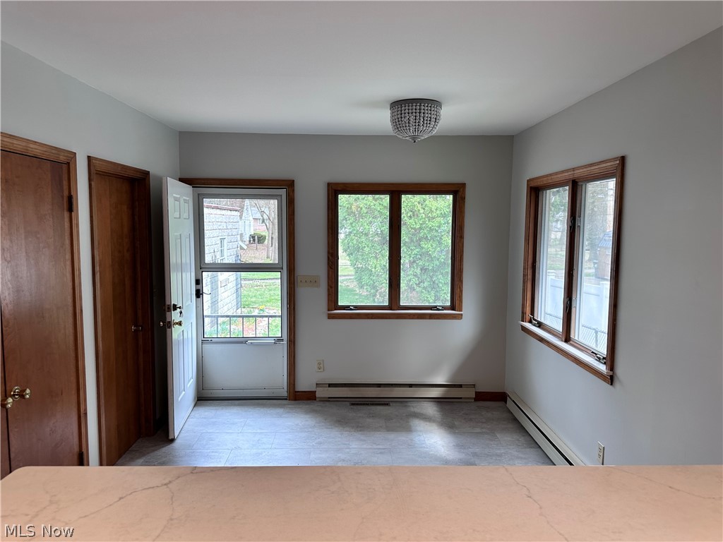 910 Cambridge Road Coshocton, OH 43812 - Photo 14 of 30 Dining area featuring a wealth of natural light and baseboard heating