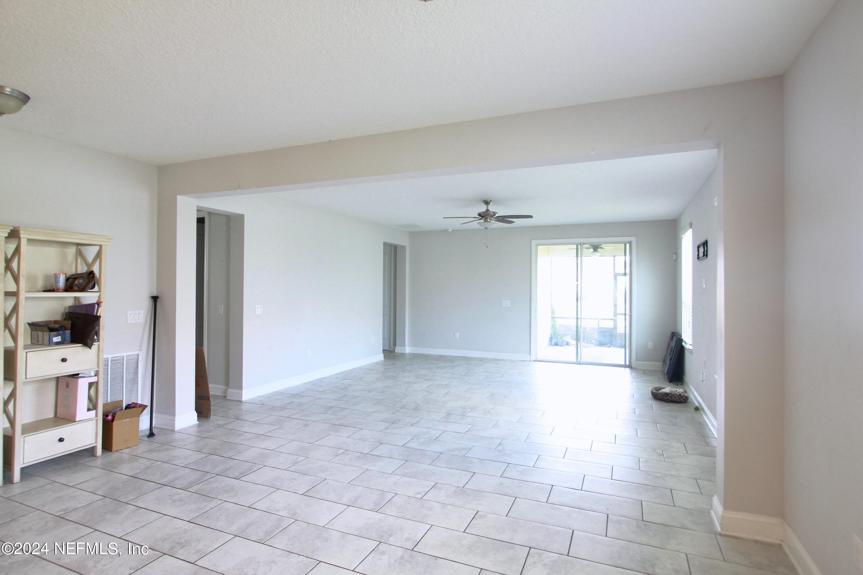 458 Convex Lane St. Augustine, FL 32095 - Photo 11 of 26 a view of a big room with closet and windows