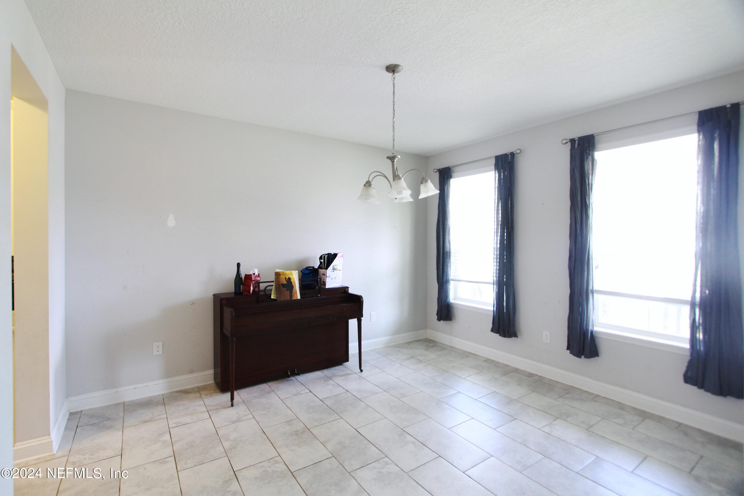 458 Convex Lane St. Augustine, FL 32095 - Photo 20 of 26 a living room with furniture and a window