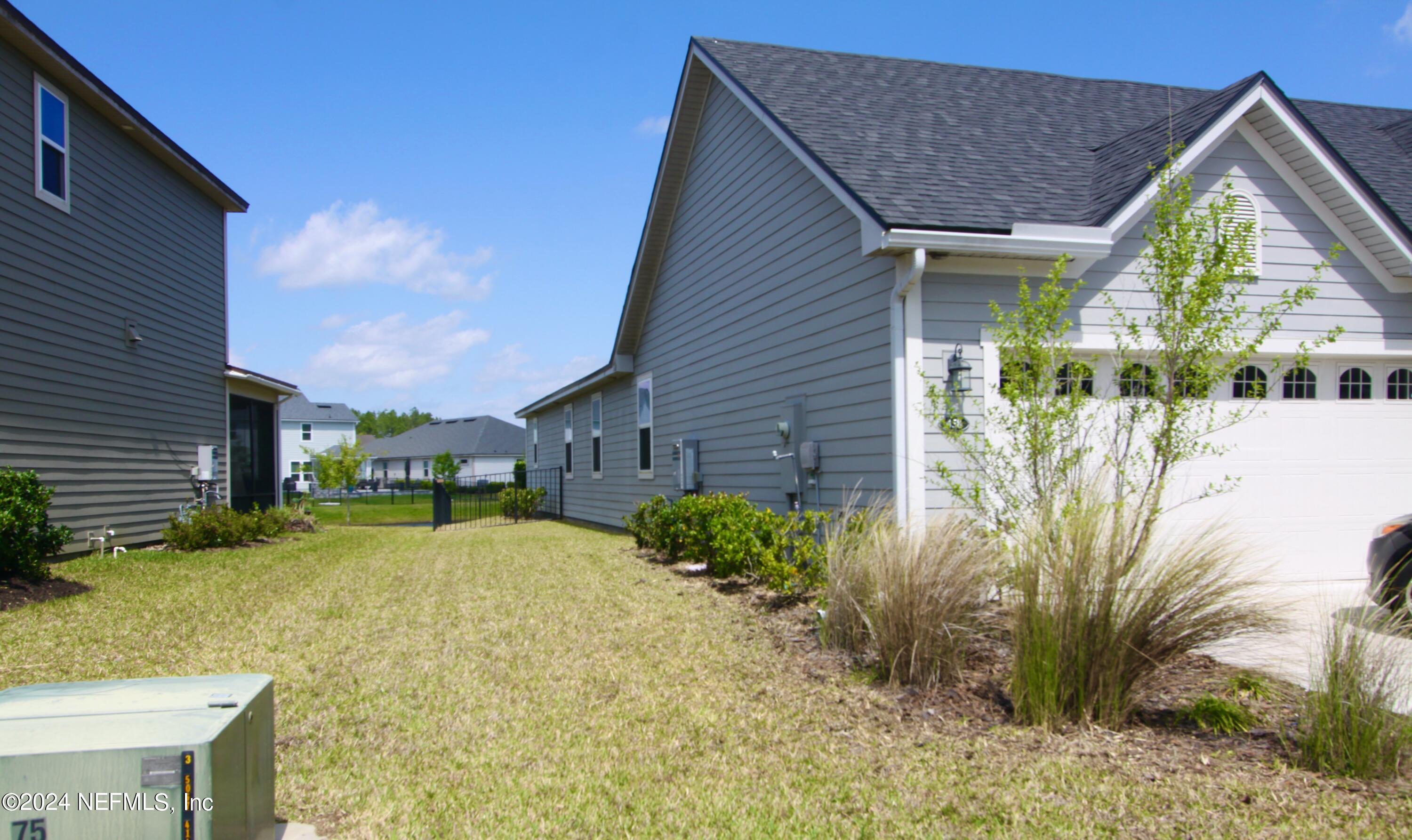 458 Convex Lane St. Augustine, FL 32095 - Photo 25 of 26 a view of a house with a yard