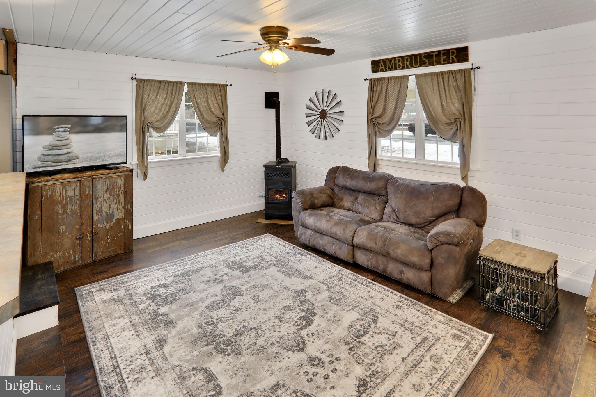 61 Cedar Street Alloway, NJ 08001 - Photo 9 of 48 LIVING ROOM WITH PELLET STOVE
