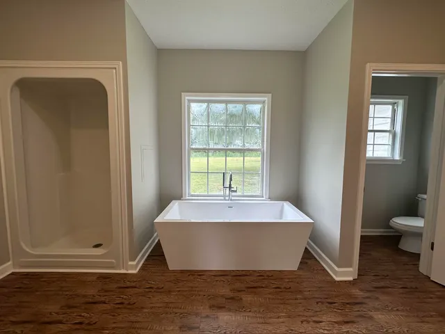 a white bath tub sitting in a bathroom