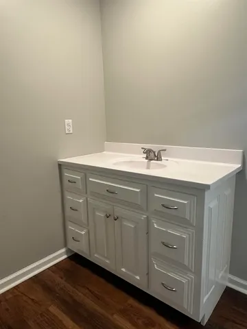 a room with cabinets and wooden floor