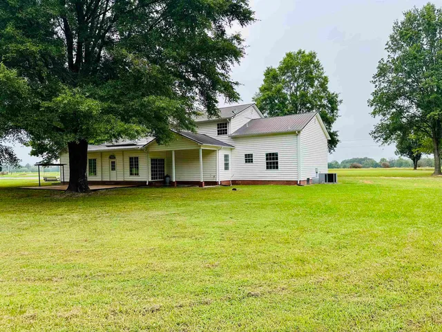 a view of a house with a swimming pool