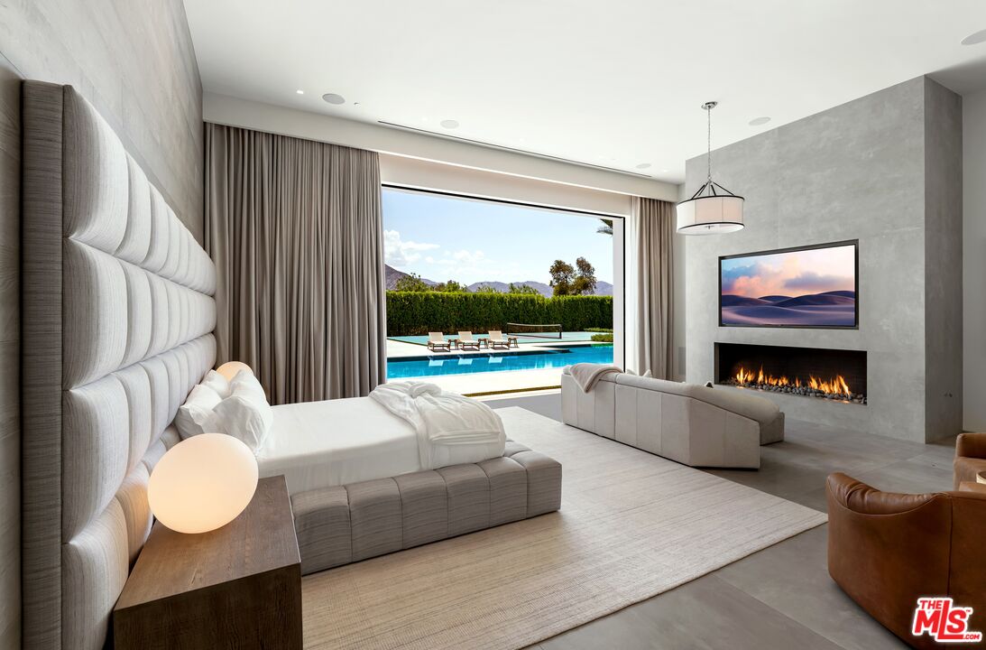 52435 Ross Avenue La Quinta, CA 92253 - Photo 16 of 39 a living room with furniture and a flat screen tv