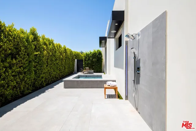 a view of a pathway both side of a house