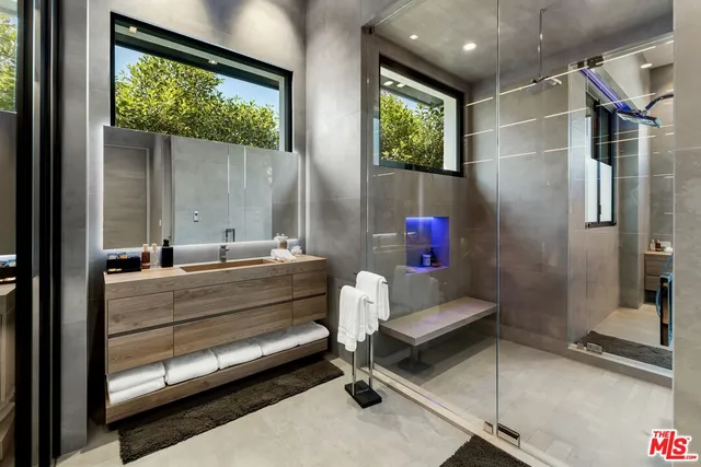 a bathroom with a bathtub and a shower
