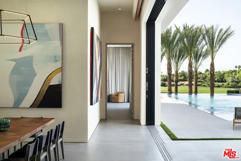 a view of a living room and a balcony