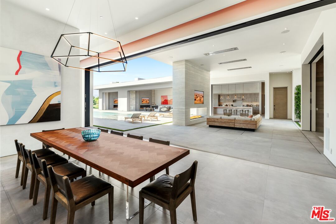 52435 Ross Avenue La Quinta, CA 92253 - Photo 25 of 39 a outdoor dining space with furniture and wooden floor