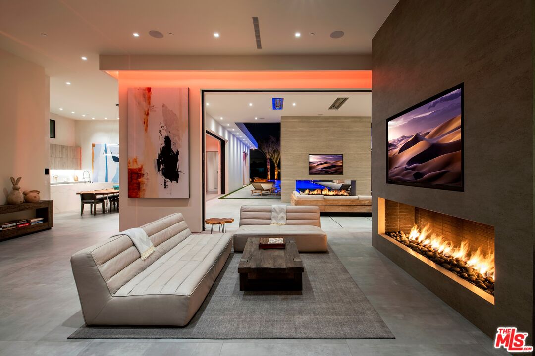 52435 Ross Avenue La Quinta, CA 92253 - Photo 27 of 39 a lobby with furniture and a flat screen tv