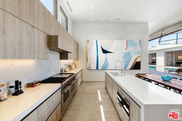a kitchen with a stove and a sink