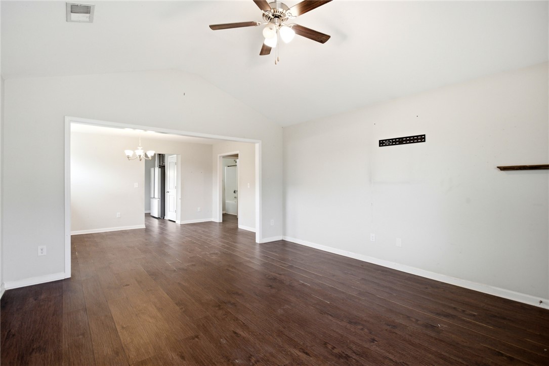 245 Maple Grove Road Seneca, SC 29678 - Photo 6 of 40 This living room features vaulted ceilings and rich wood flooring, ideal for contemporary living.