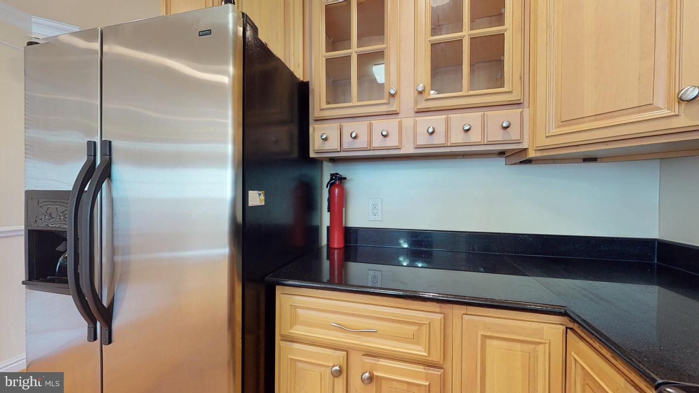 615 16th Street Northeast Washington, DC 20002 - Photo 12 of 33 a kitchen with stainless steel appliances granite countertop a refrigerator and a cabinets