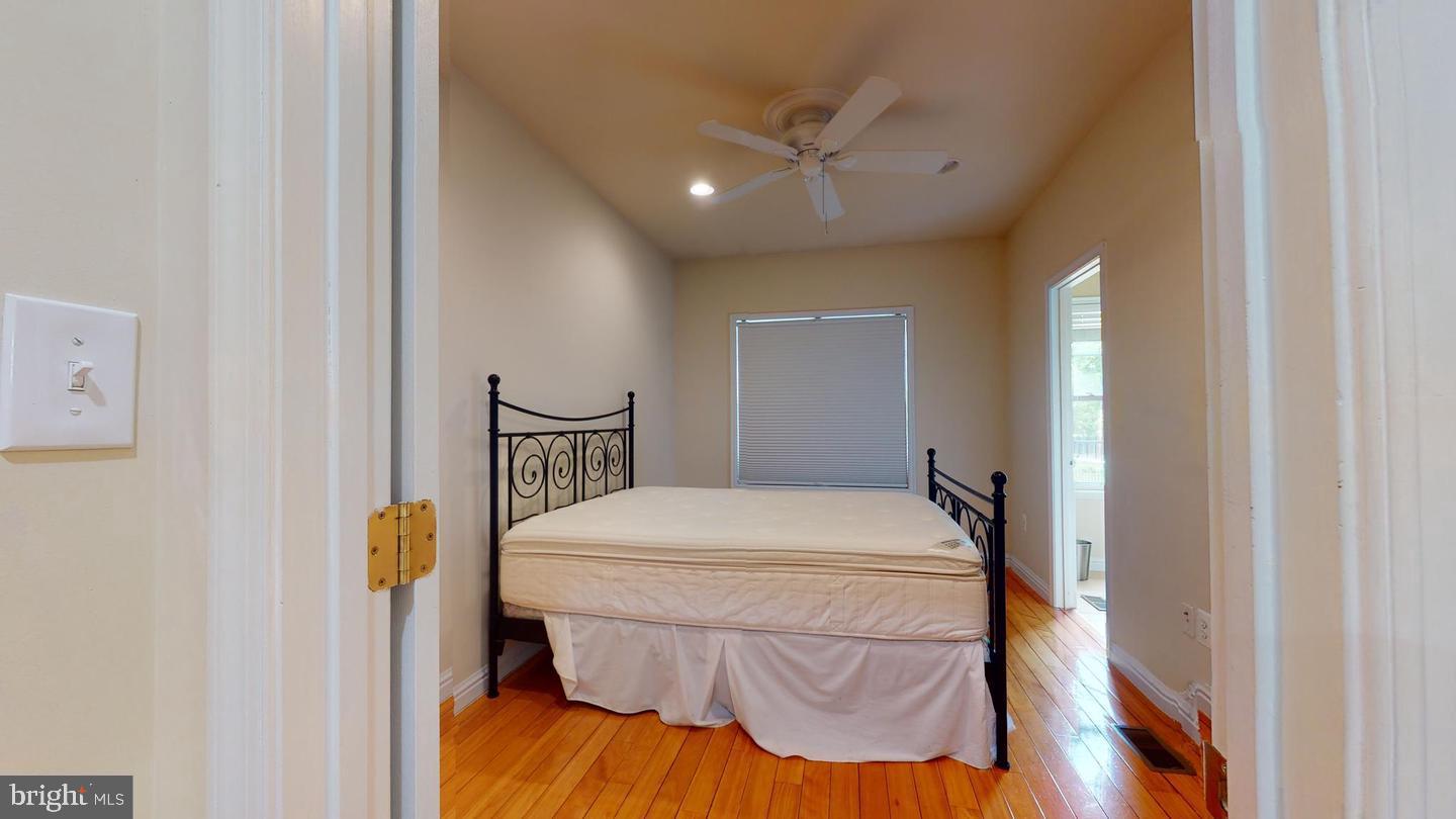 615 16th Street Northeast Washington, DC 20002 - Photo 18 of 33 a bedroom with a bed and a chandelier