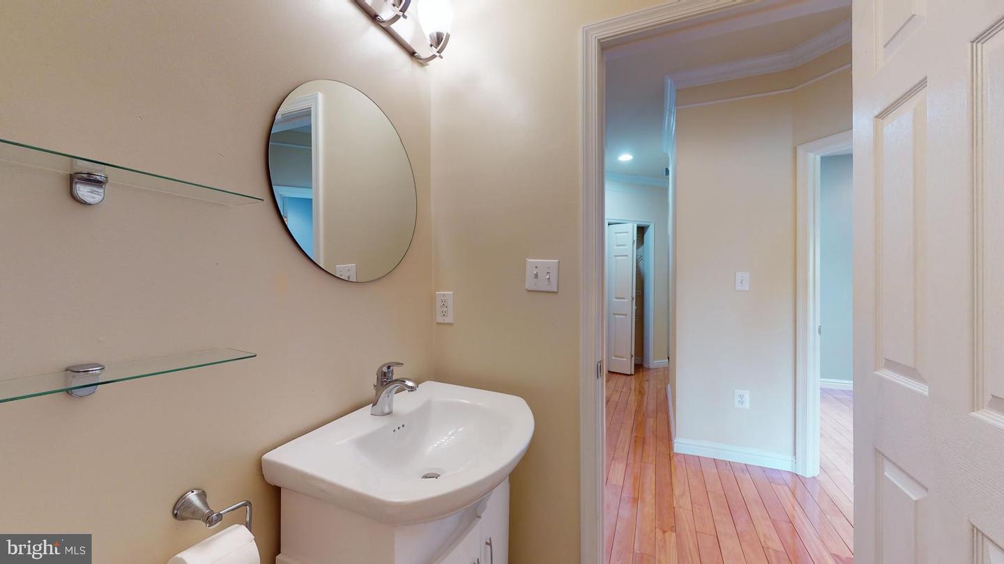615 16th Street Northeast Washington, DC 20002 - Photo 25 of 33 a bathroom with a sink and a mirror