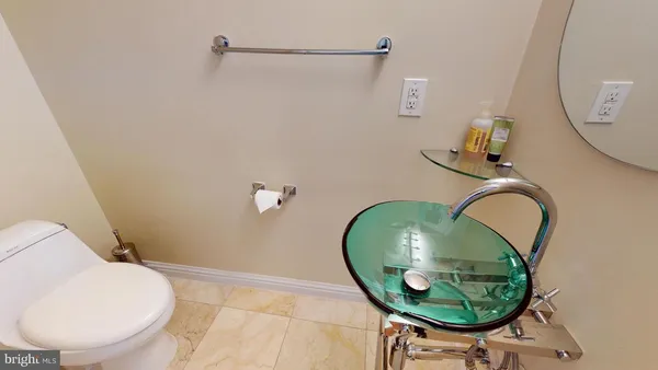 a bathroom with a sink and mirror