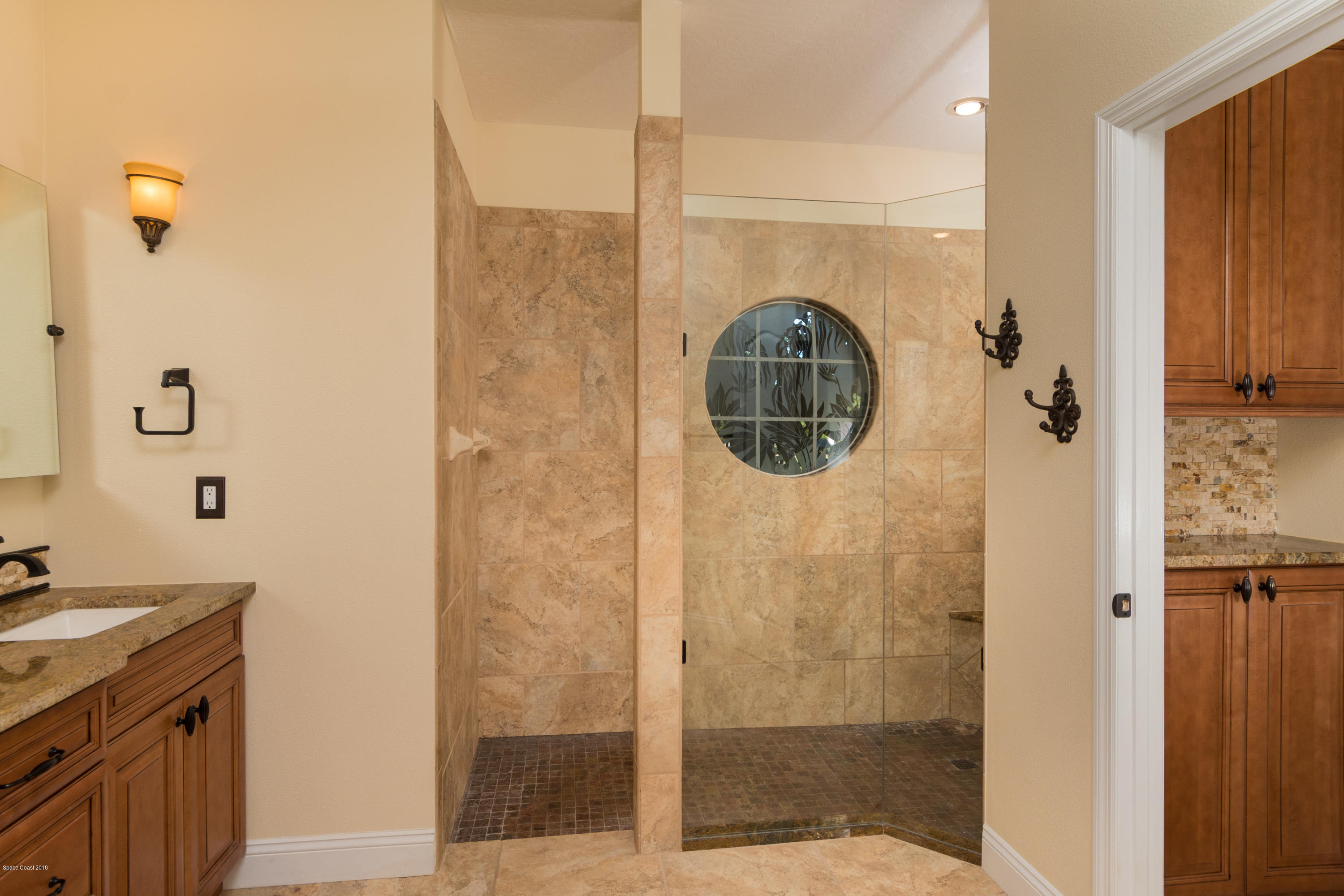 3420 Shady Run Road Melbourne, FL 32934 - Photo 14 of 33 a bathroom with a shower and a sink