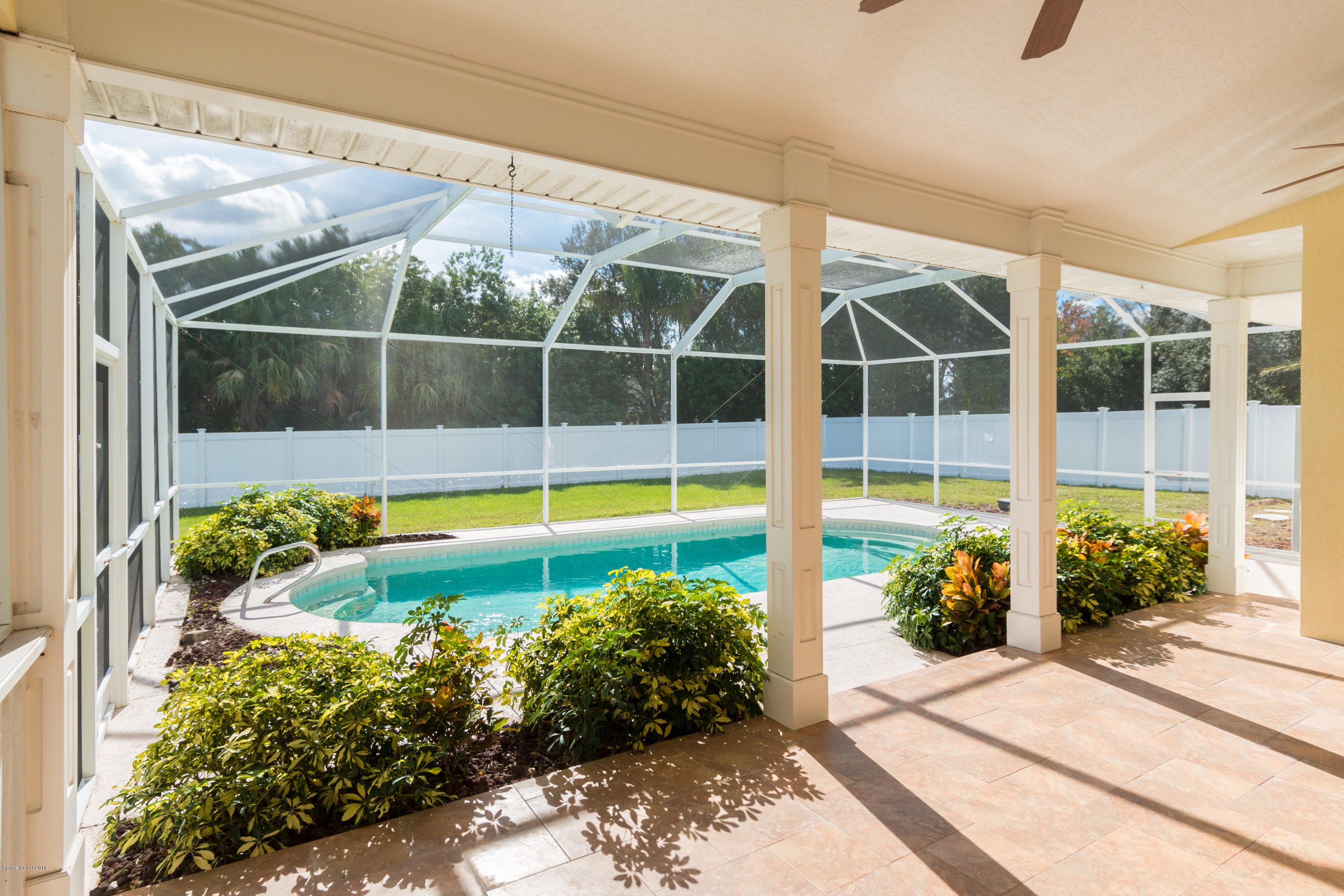 3420 Shady Run Road Melbourne, FL 32934 - Photo 18 of 33 a view of a swimming pool with potted plants