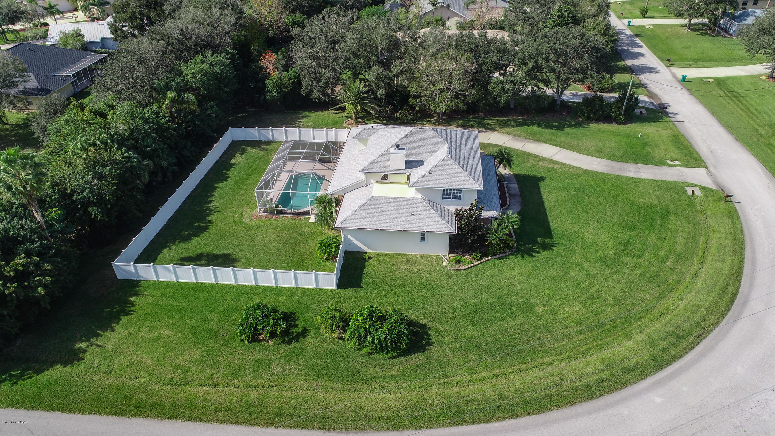 3420 Shady Run Road Melbourne, FL 32934 - Photo 22 of 33 a view of a house with a yard