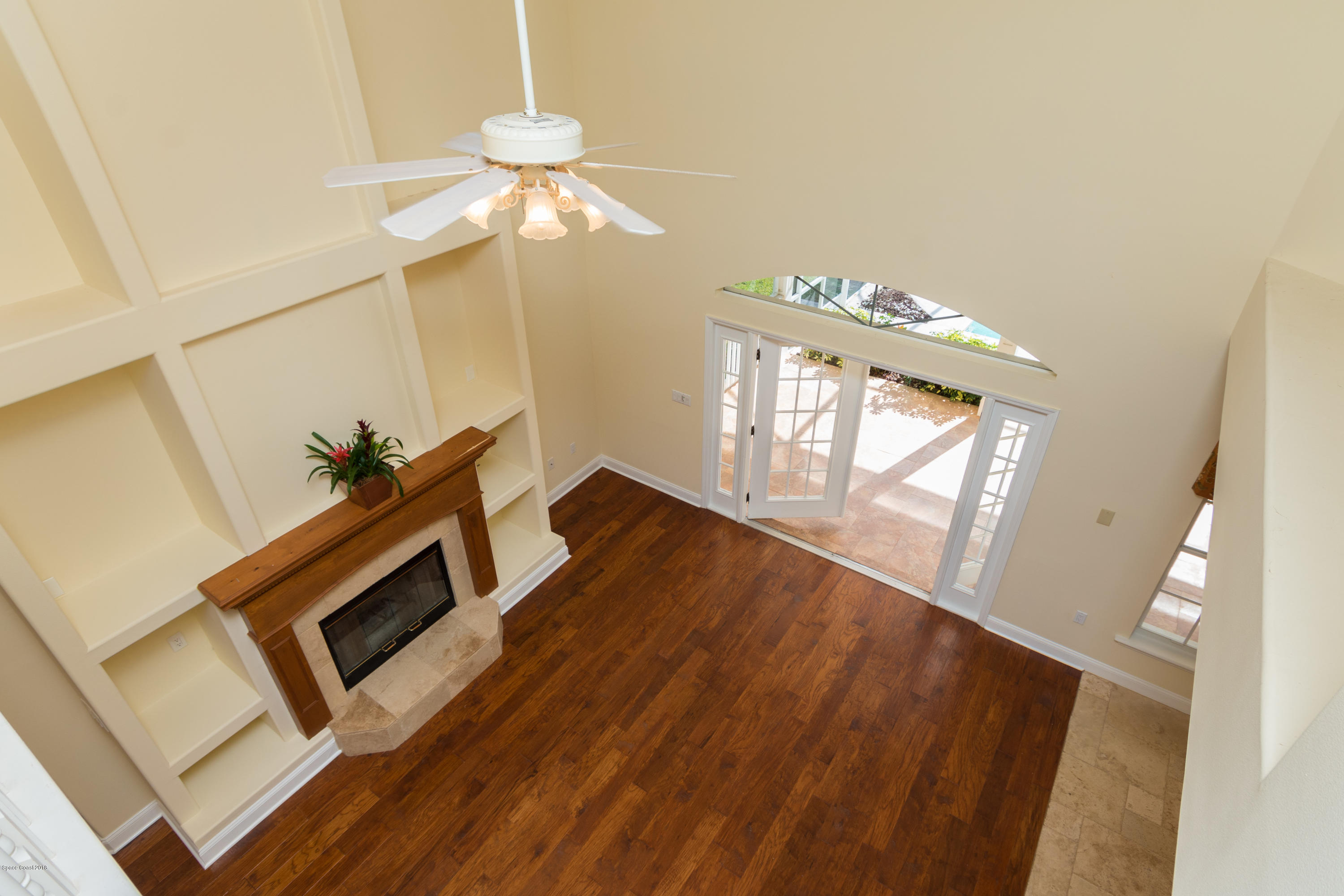3420 Shady Run Road Melbourne, FL 32934 - Photo 4 of 33 a living room with furniture and a fireplace