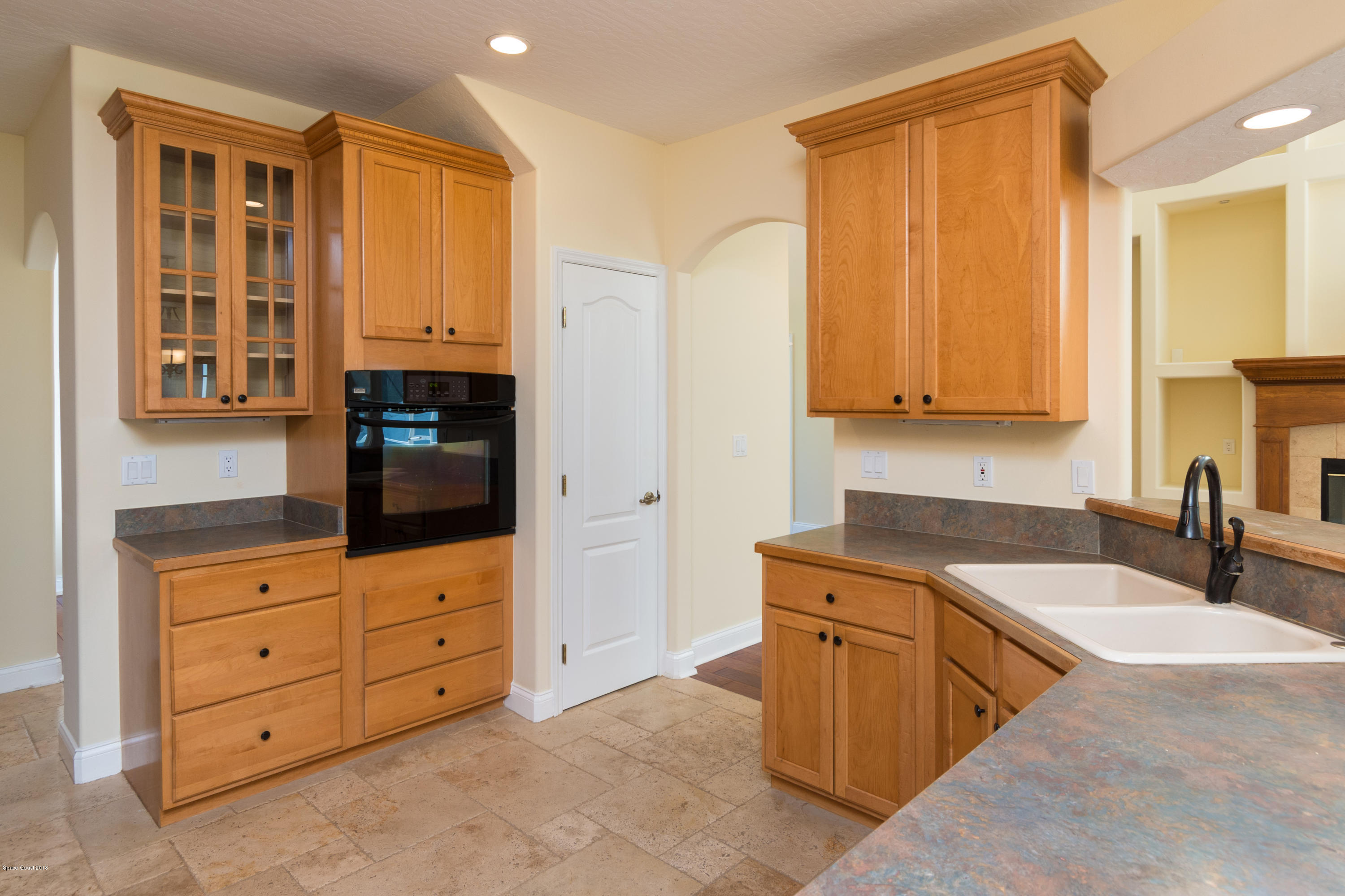 3420 Shady Run Road Melbourne, FL 32934 - Photo 10 of 33 a kitchen with stainless steel appliances granite countertop a sink and cabinets