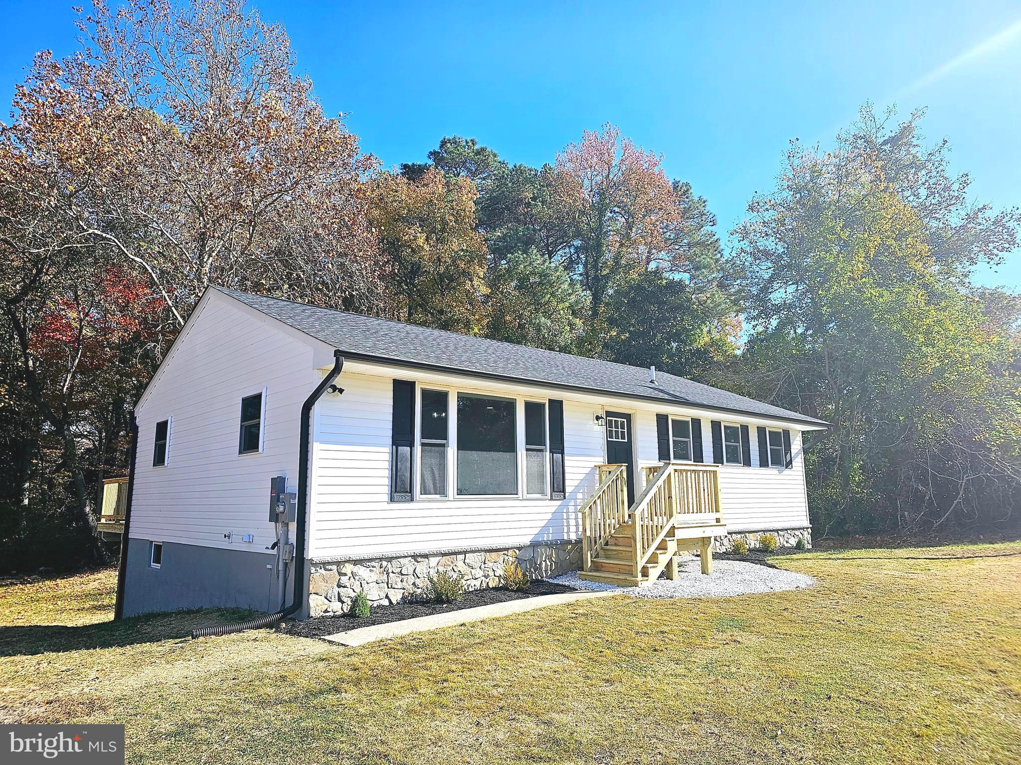 15388 Point Lookout Road St. Inigoes, MD 20684 - Photo 2 of 29 a view of a house with a yard