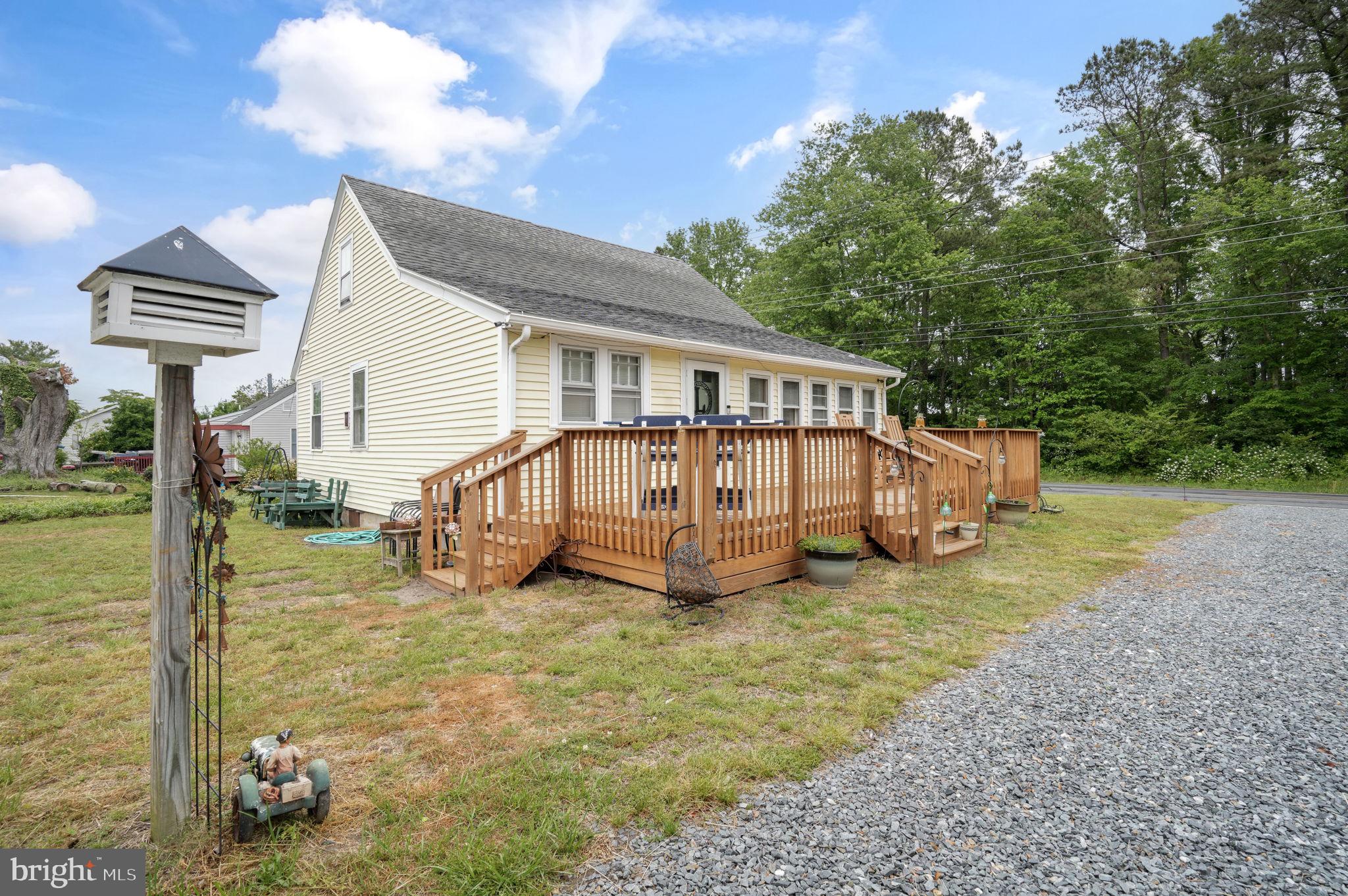 7278 Fleming Road New Church, VA 23415 - Photo 33 of 44 a view of a house with backyard and porch