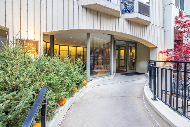 an entrance to house with yard and outdoor seating