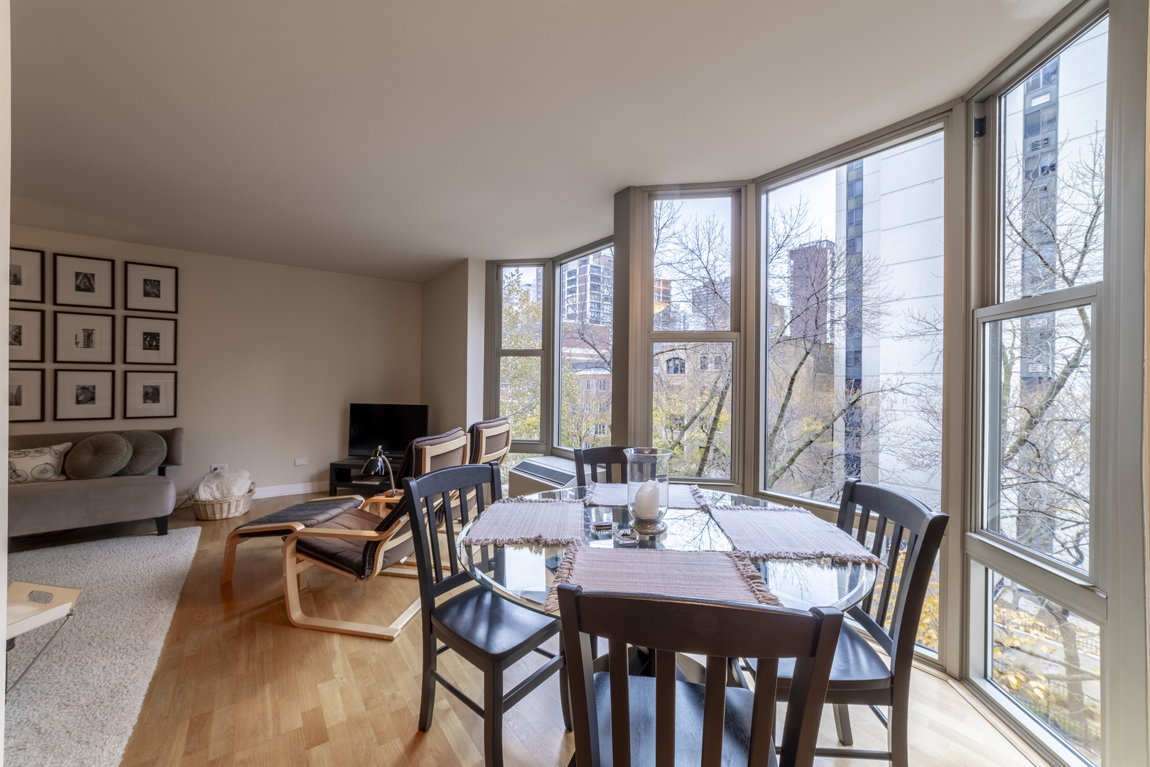 1340 North Dearborn Street, Unit 5C Chicago, IL 60610 - Photo 14 of 44 a view of a dining room with furniture and wooden floor