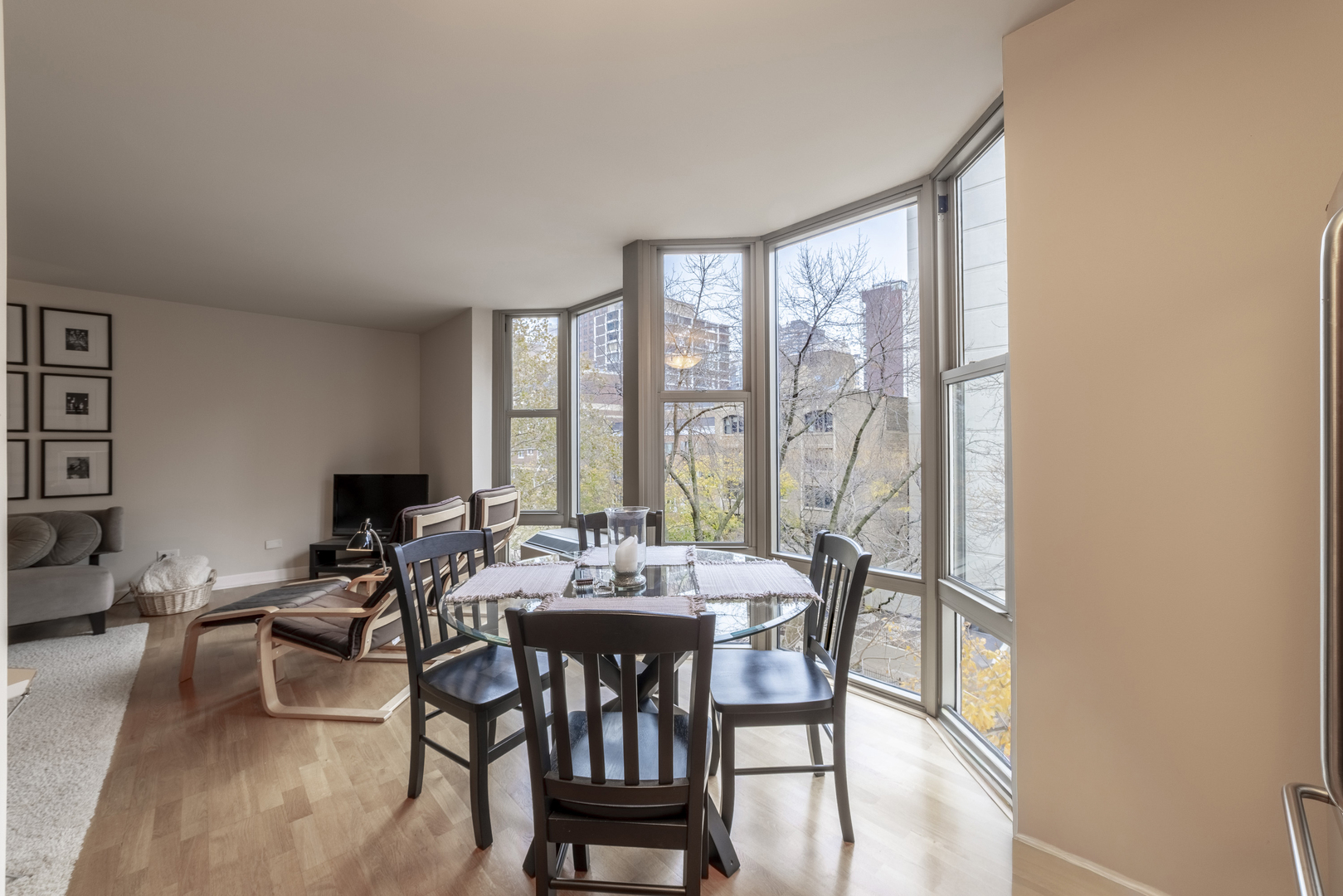 1340 North Dearborn Street, Unit 5C Chicago, IL 60610 - Photo 15 of 44 a dining room with furniture and wooden floor