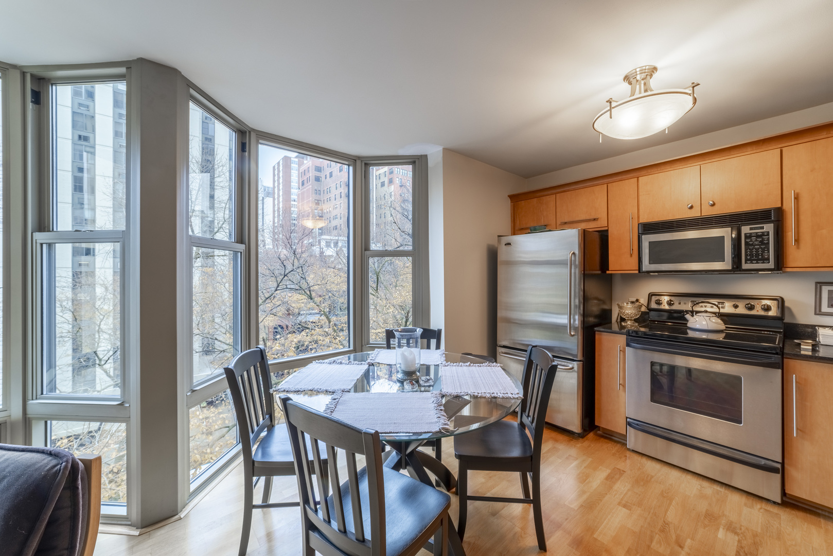 1340 North Dearborn Street, Unit 5C Chicago, IL 60610 - Photo 16 of 44 a view of a dining room with furniture window and outside view