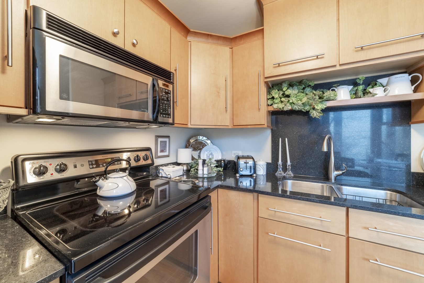1340 North Dearborn Street, Unit 5C Chicago, IL 60610 - Photo 18 of 44 a kitchen with a stove microwave and cabinets