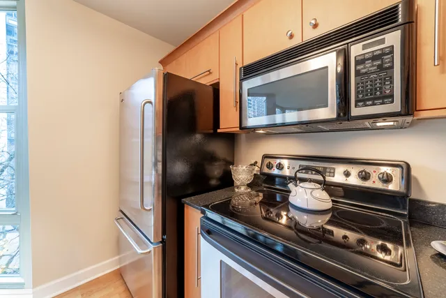 a kitchen with a stove and a microwave
