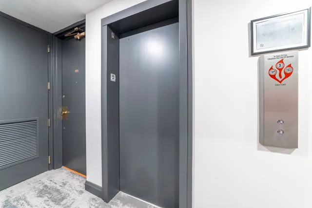 a view of a hallway with paintings on the wall