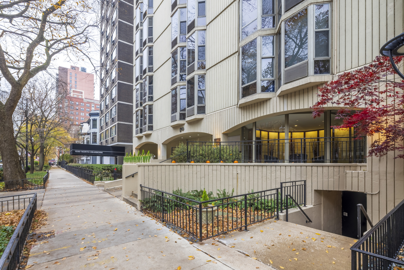 1340 North Dearborn Street, Unit 5C Chicago, IL 60610 - Photo 37 of 44 a view of a brick building with a tree in front