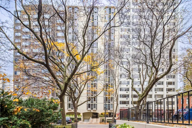 a building with trees in front of it