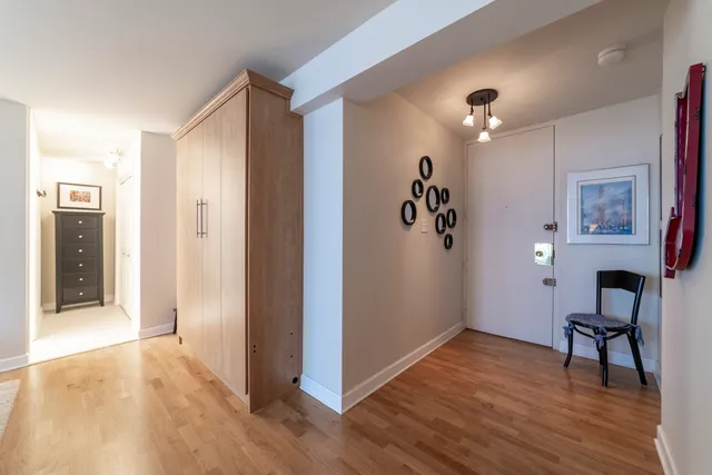 a view of a livingroom with furniture and wooden floor