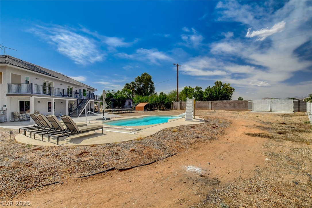 4362 Thistle Street Logandale, NV 89021 - Photo 79 of 99 A refreshing outdoor pool with ample lounging space complements the multi-level residence.