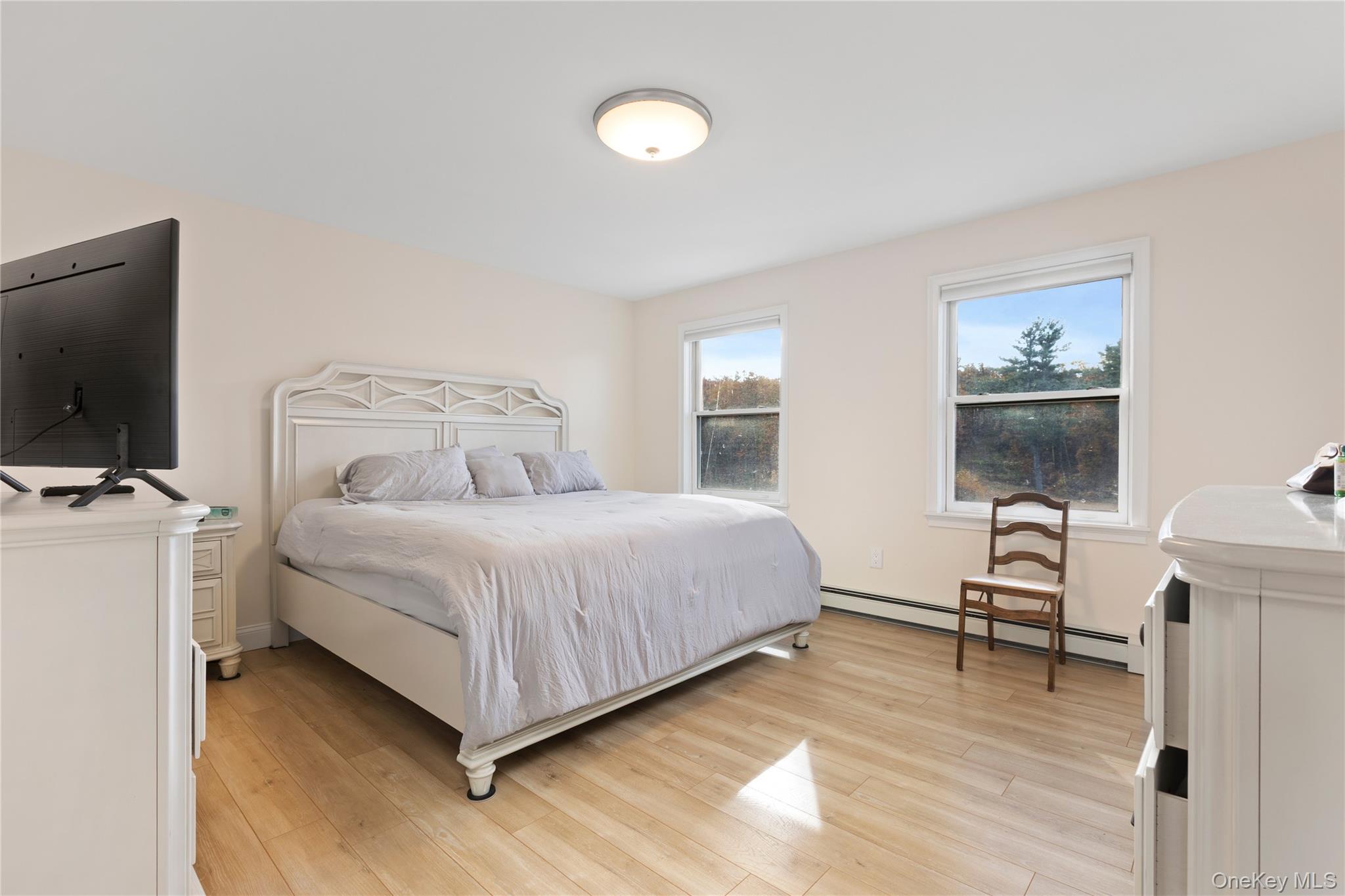 216 N Road Red Hook, NY 12571 - Photo 14 of 20 a bedroom with a bed and a flat screen tv