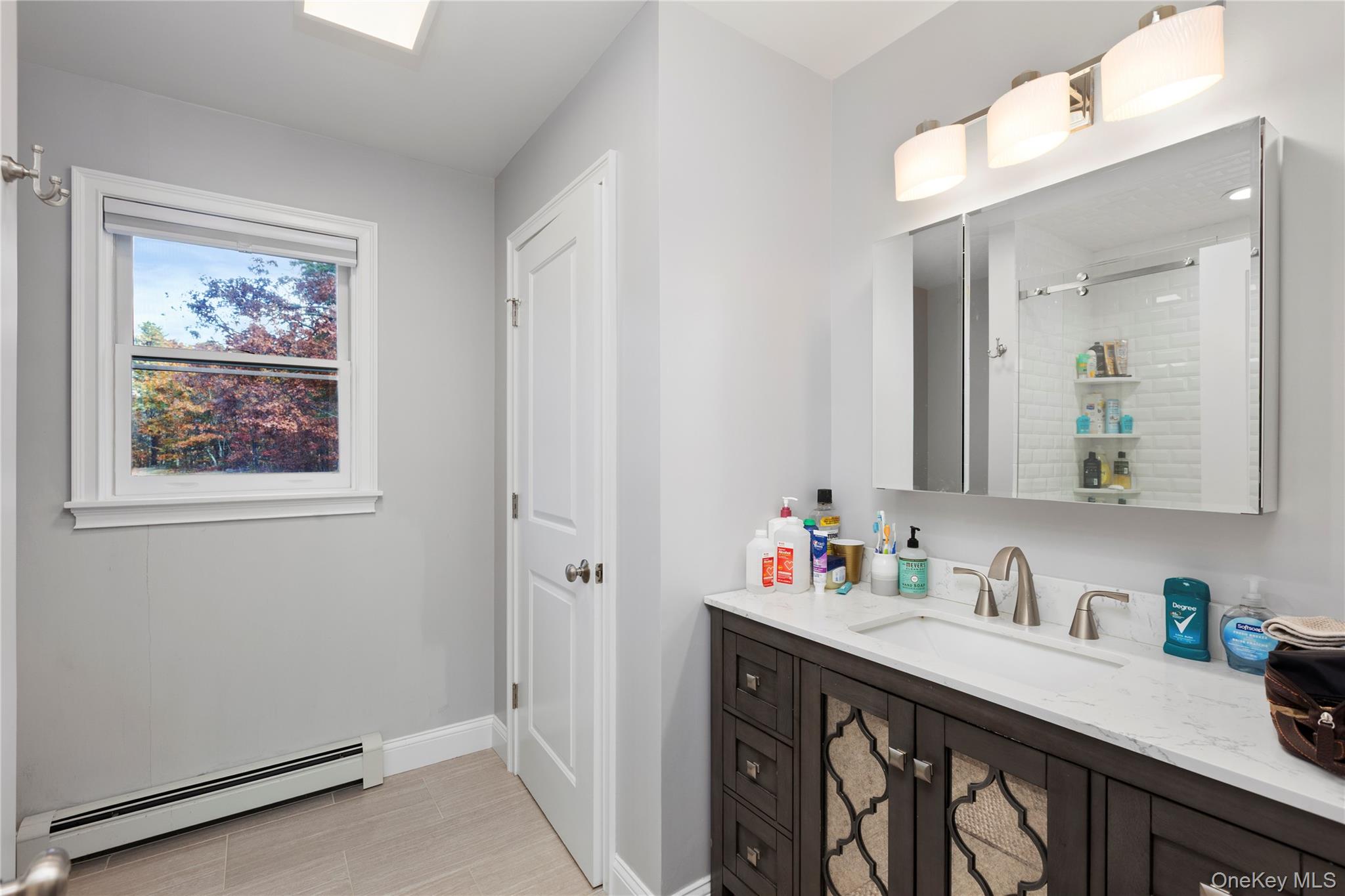 216 N Road Red Hook, NY 12571 - Photo 16 of 20 a bathroom with a sink vanity and a mirror
