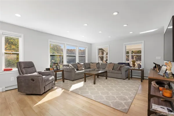 a living room with furniture and a window