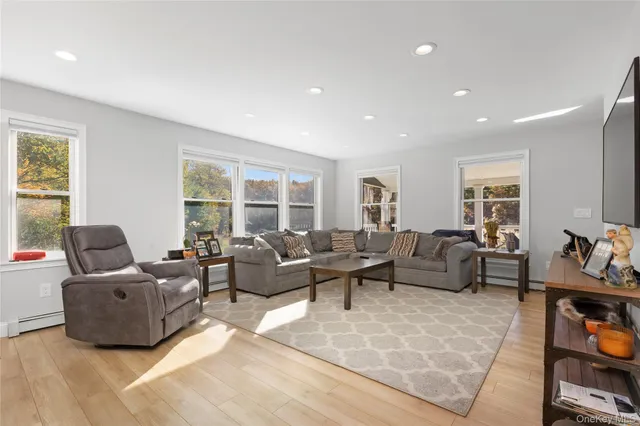 a living room with furniture and a window