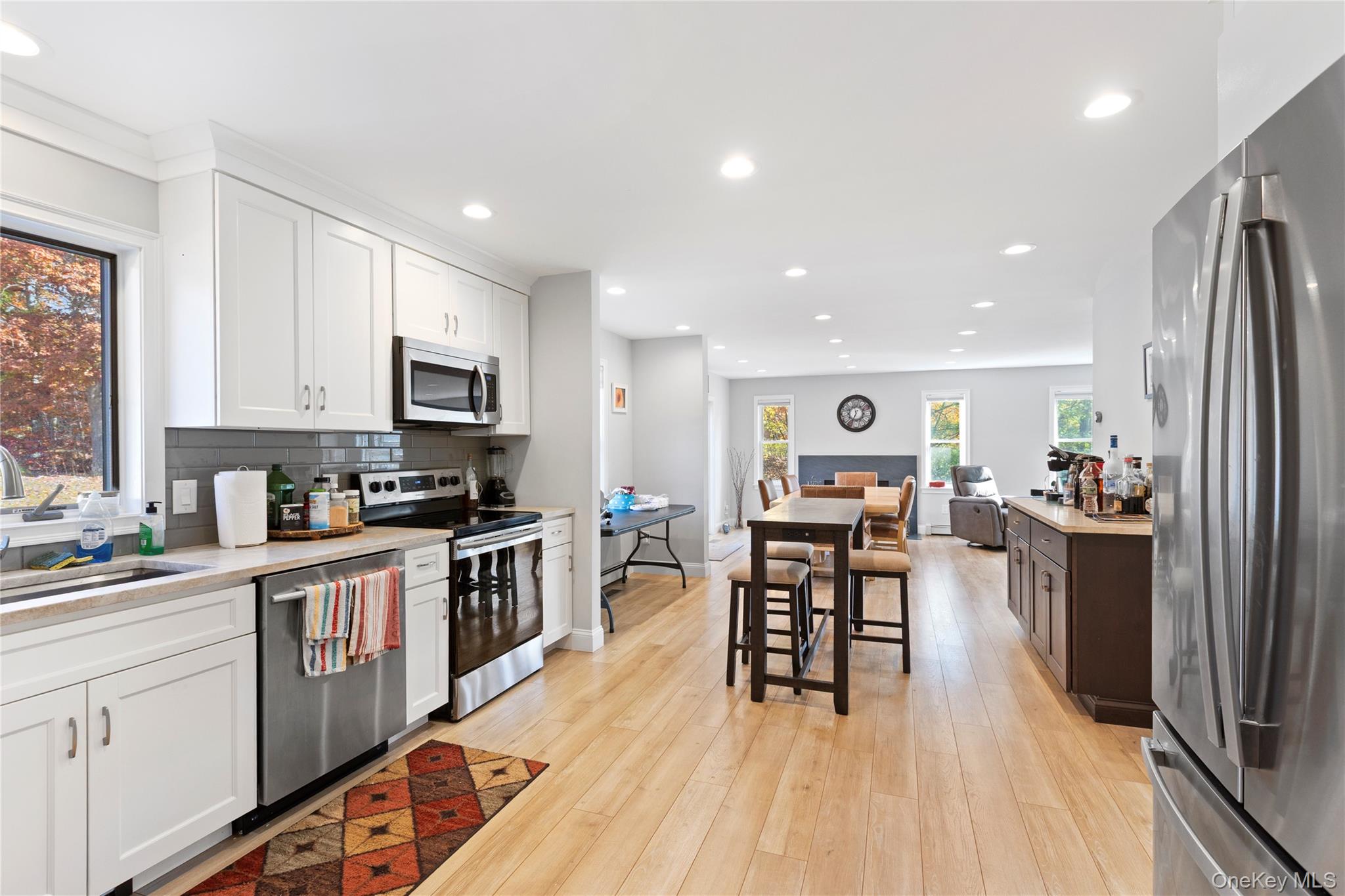 216 N Road Red Hook, NY 12571 - Photo 20 of 20 a kitchen with stainless steel appliances granite countertop refrigerator stove microwave and cabinets