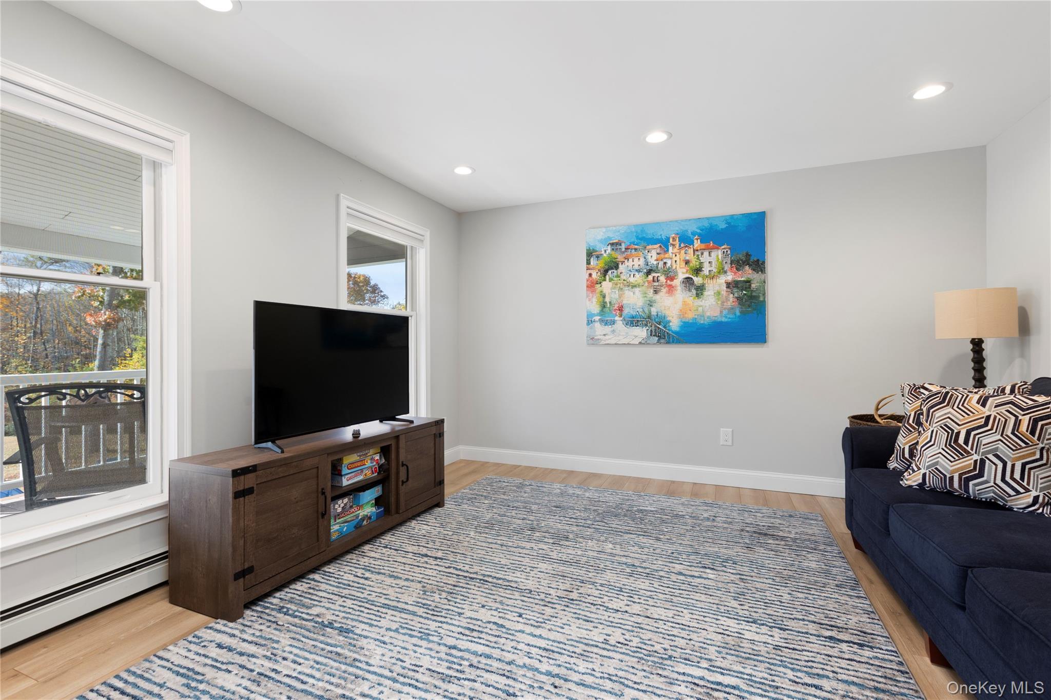216 N Road Red Hook, NY 12571 - Photo 6 of 20 a living room with furniture and a flat screen tv