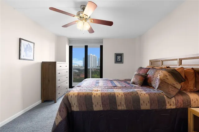 a view of a kitchen with wooden floor and stainless steel appliances