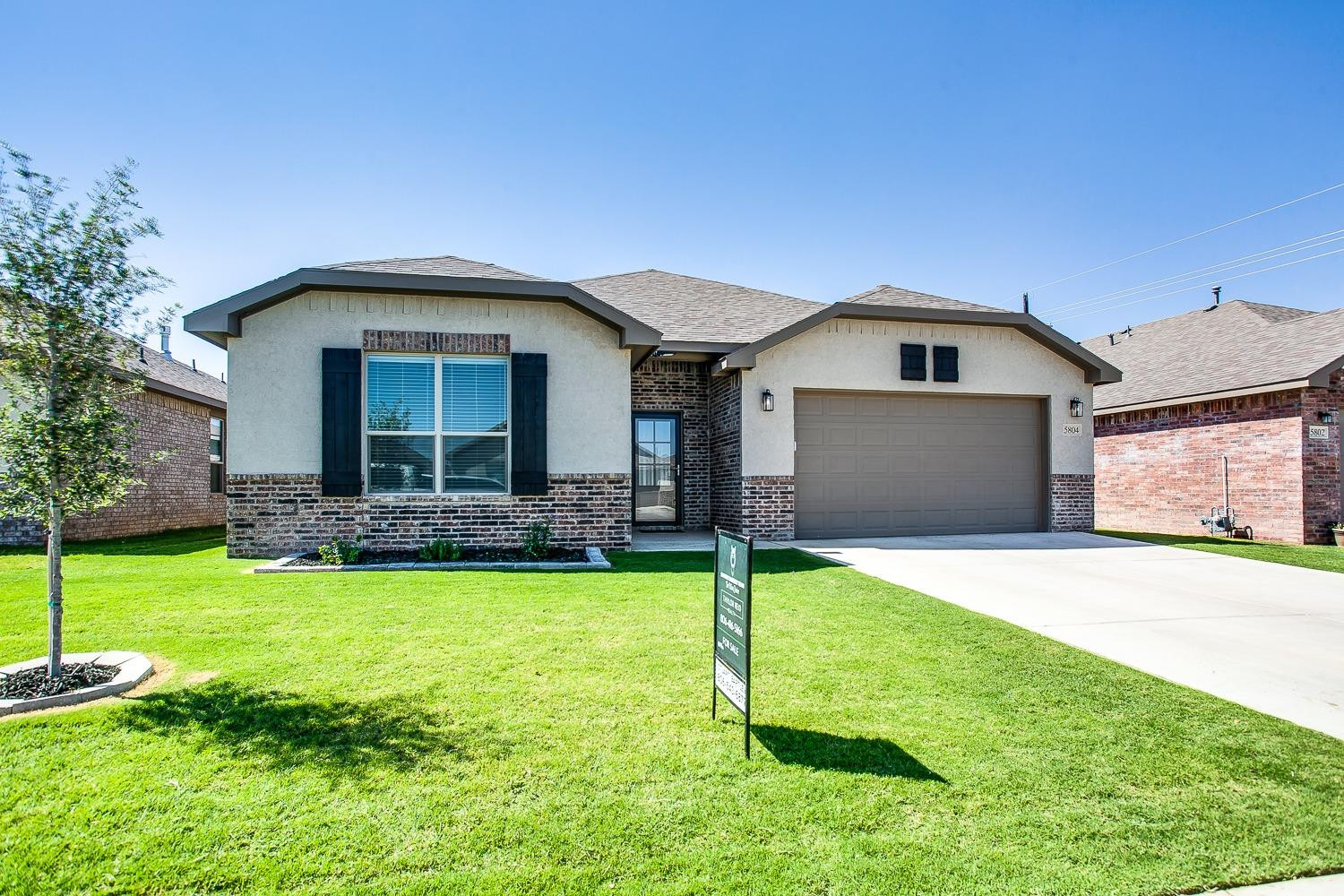 5804 Winfield Avenue Lubbock, TX 79407 - Photo 1 of 18 a front view of a house with a yard