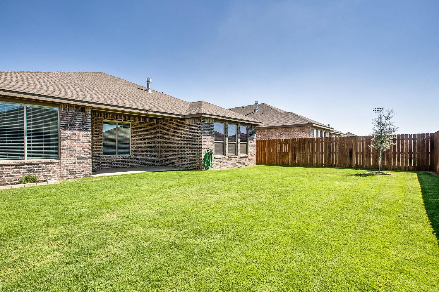5804 Winfield Avenue Lubbock, TX 79407 - Photo 18 of 18 a front view of a house with yard