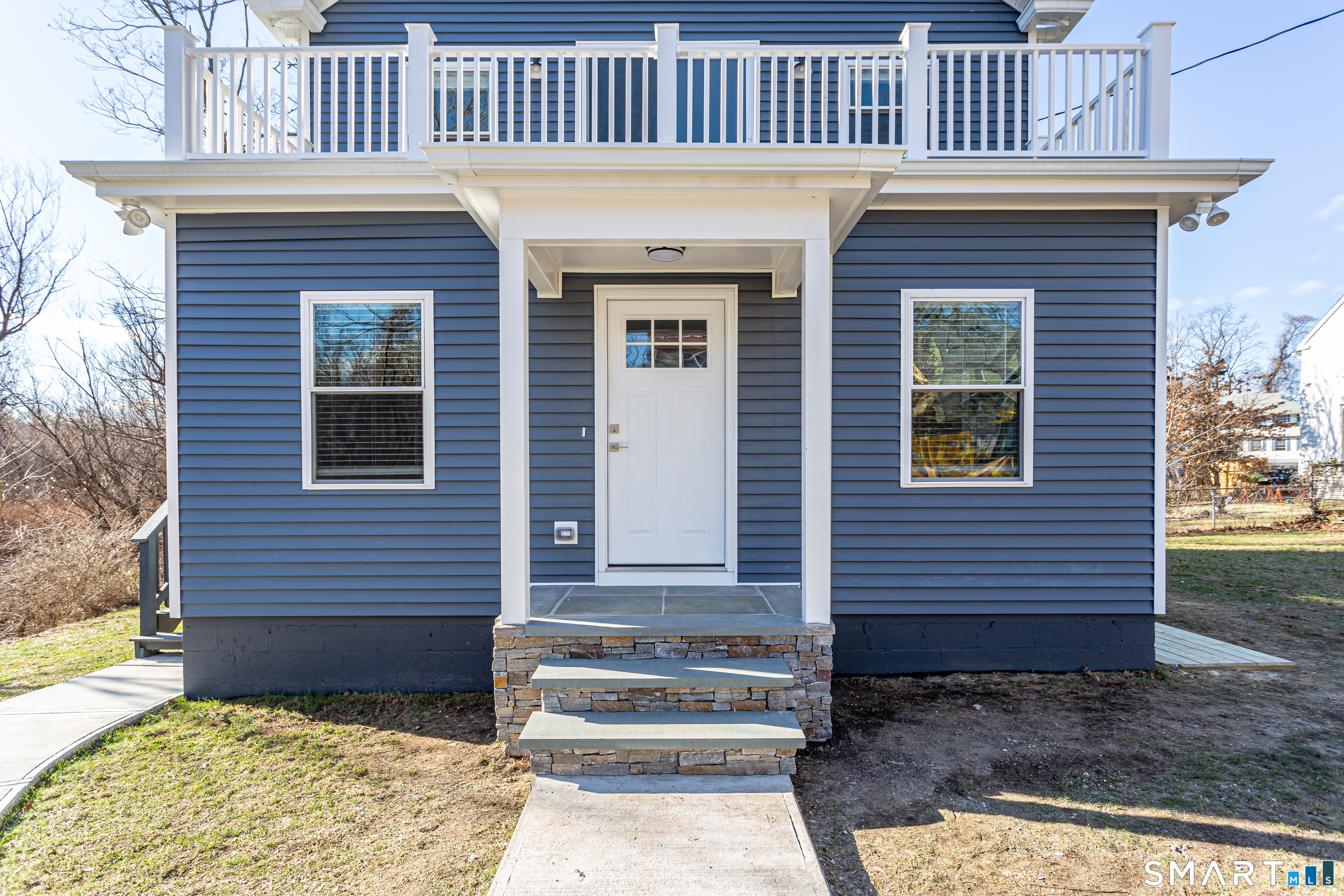 65 Mason Street Fairfield, CT 06825 - Photo 1 of 30 a front view of a house with a garden