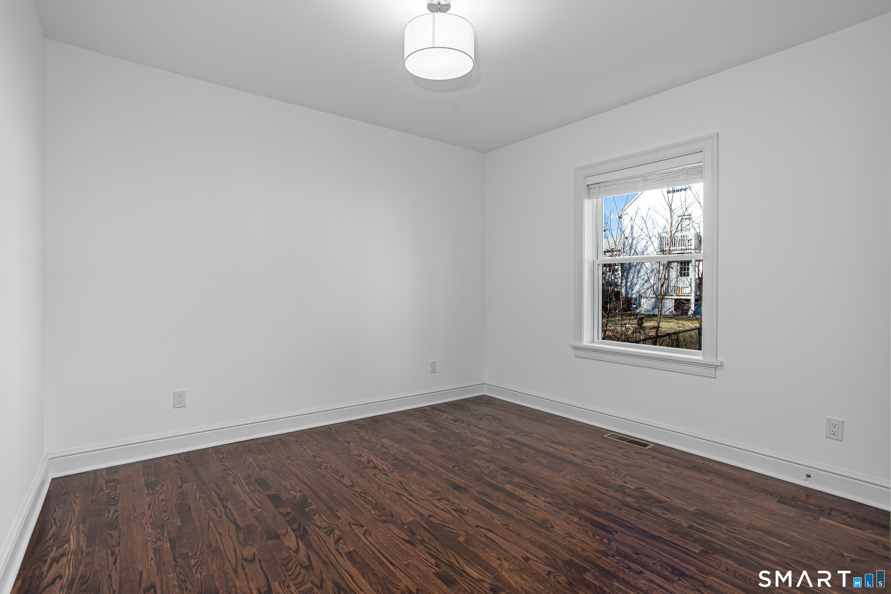 65 Mason Street Fairfield, CT 06825 - Photo 13 of 30 wooden floor in an empty room with a window
